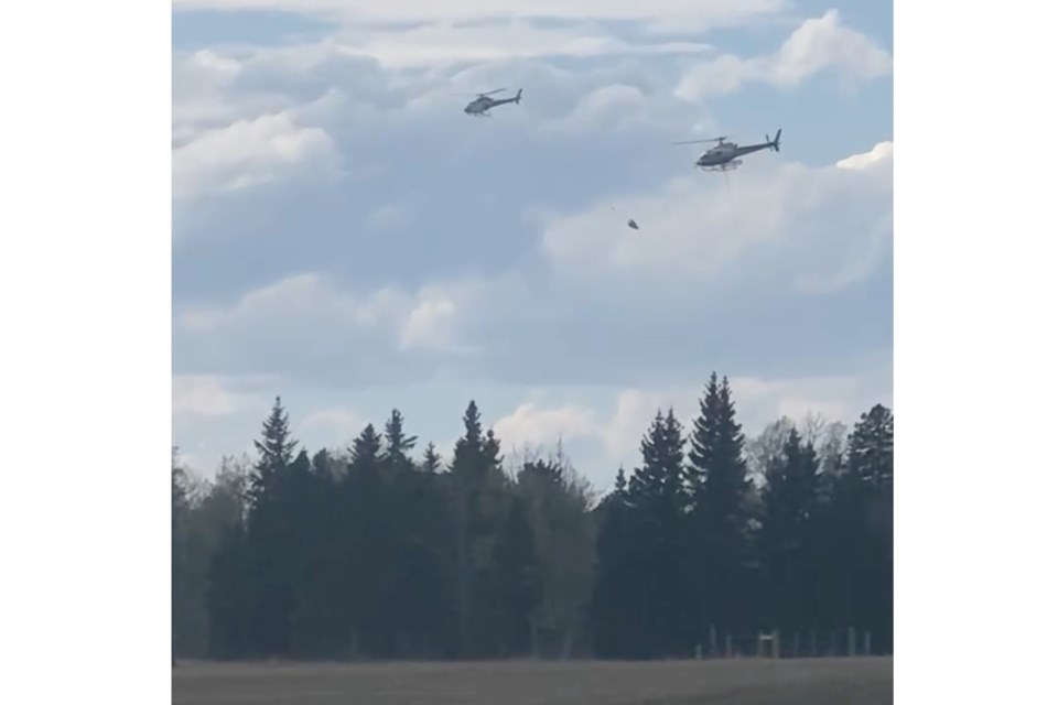 A still image from a video captured by Dean Unruh on Saturday, May 3 at approximately 4:40 p.m. of the multi-agency response to a wildfire that started in the proximity of the TAQA gas plant northwest of Sundre and burned out of control for approximately seven hours before being classified as contained.
Image courtesy of Dean Unruh