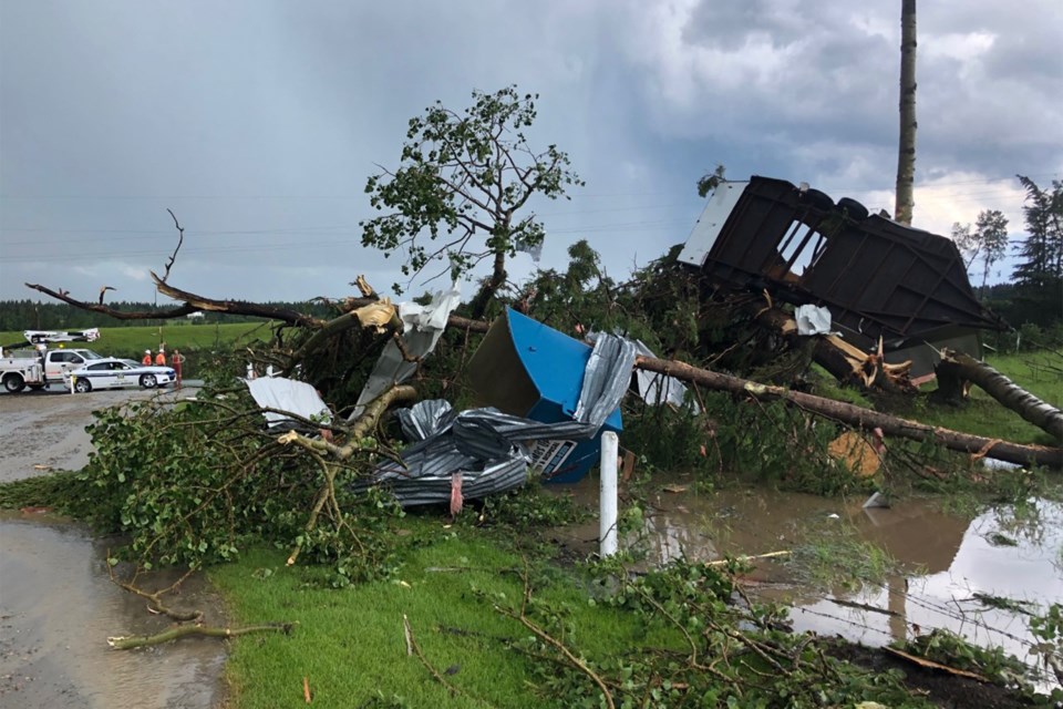 Fortis, peace officers and other first responders were out in the Bergen area of Mountain View County on the afternoon of July 7 assessing damage from a storm that Environment Canada said produced a tornado. 
Dan Singleton/MVP Staff