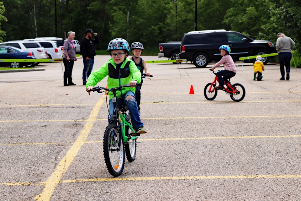During the recent Bike Rodeo organizers set up a course in the parking lot at the Innisfail Library/Learning Centre for young cyclists to test their safety skill levels.  
