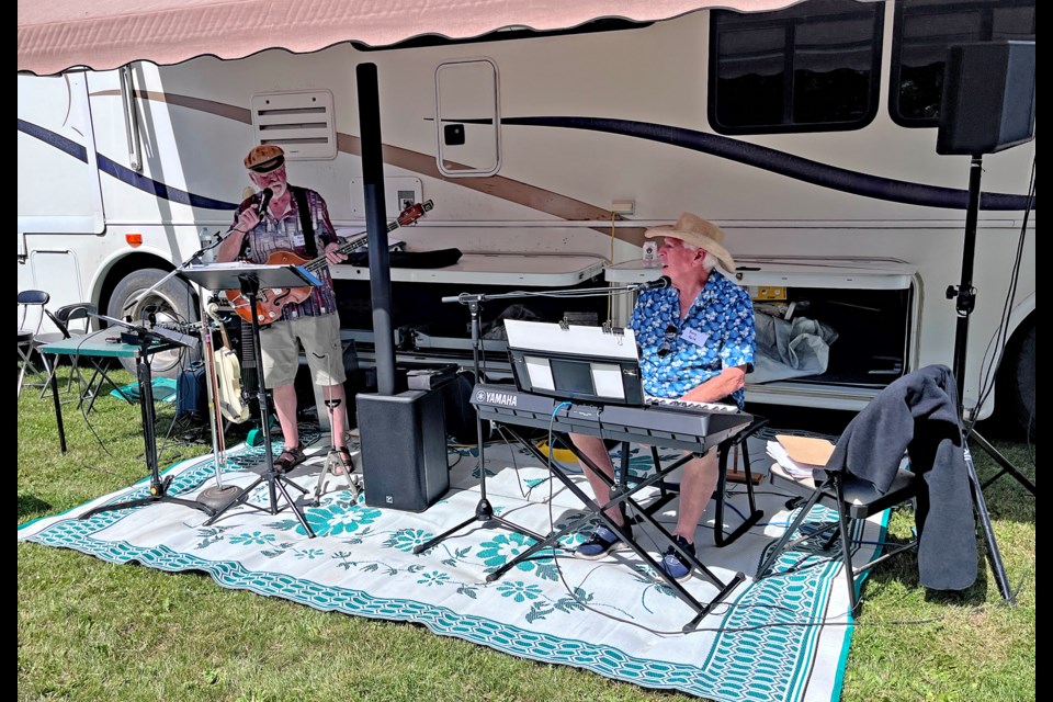 Murray Cameran (left) plays guitar while Barry Lloyd provides keyboard entertainment at the 11th annual Block Party on July 12 for residents on Innisfail's 46A Street Crescent. Photo by David Foreman
