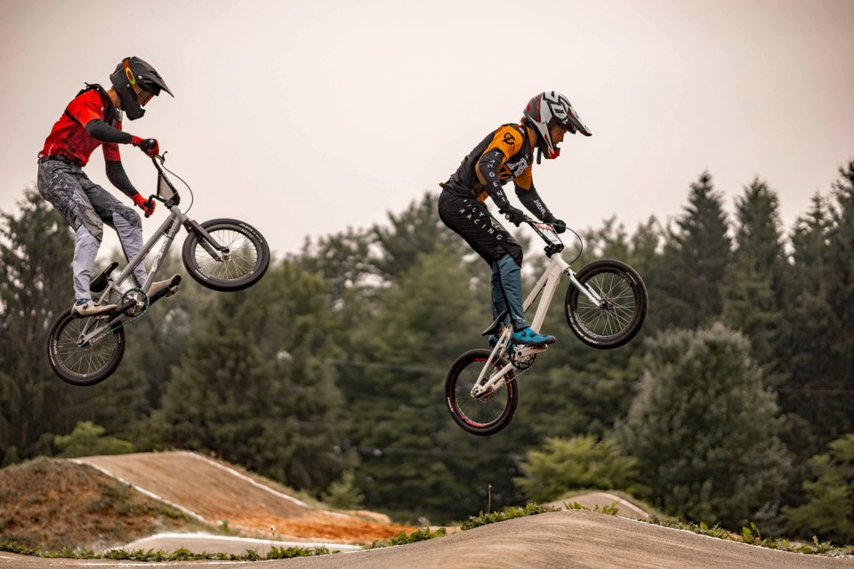 Innisfail's Carson Kowaski, right, is airborne at the 2023 Canadian BMX Championship tourney in Drummondville, Que. The 18-year-old is now the Canadian BMX junior champ. 
Photo by Rosalie Vermette
