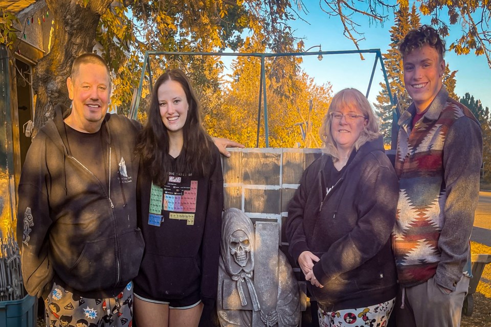 Bowden's Mackie family inside the front yard grounds of the town's celebrated Hallowe’en House. From left to right is father Steve, daughter Shelby, mother Stacey and son Gage. 
Photo by Candice Hughes