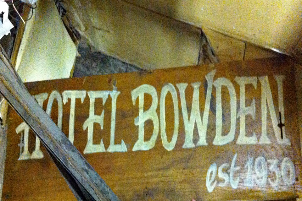 The old Bowden Hotel sign that was hiding in the basement in 2014 during a tour. The pioneer hotel was abandoned the following year, and was demolished on New Year's Day 2022 following a devastating fire on the same day. Photo by Jade Prefontaine