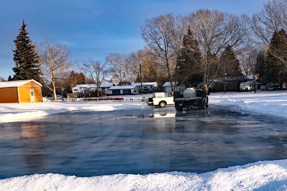 Bowden's public works staff work on the new outdoor rink recently created in Centennial Park, south of the Bowden Igloo Arena and behind the FCSS building. Submitted photo
