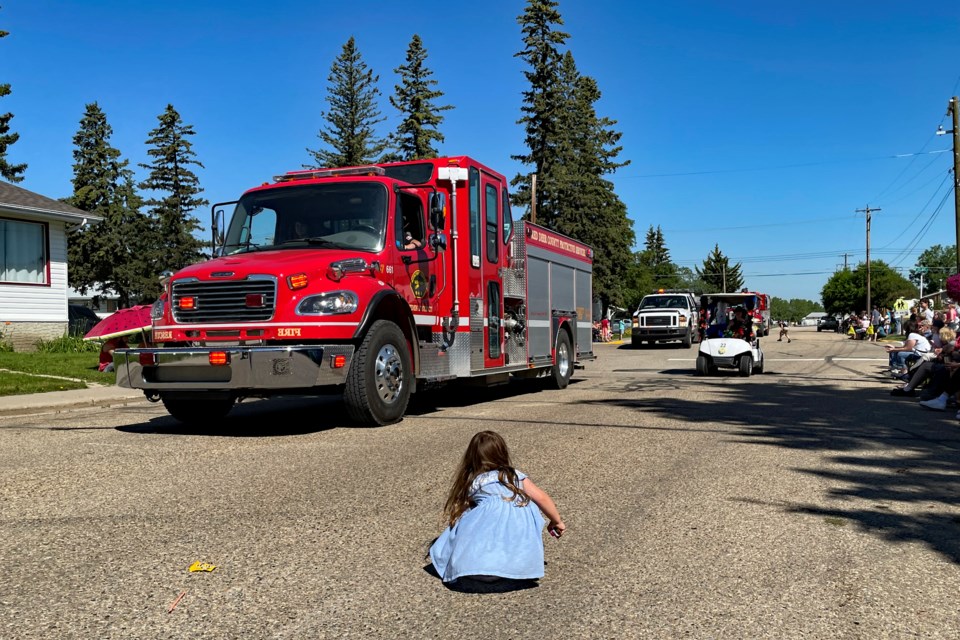 A young child hurriedly grabs candies off the street as a big fire engine approaches during the Bowden Daze Parade on July 16. It was the first annual parade in town since 2019, a casualty in 2021 and 2020 of the COVID-19 pandemic.
Johnnie Bachusky/MVP Staff