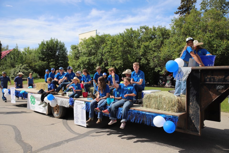 Members of the Bow-Inn 4H Beef club ride down the street.
Doug Collie/MVP Staff
