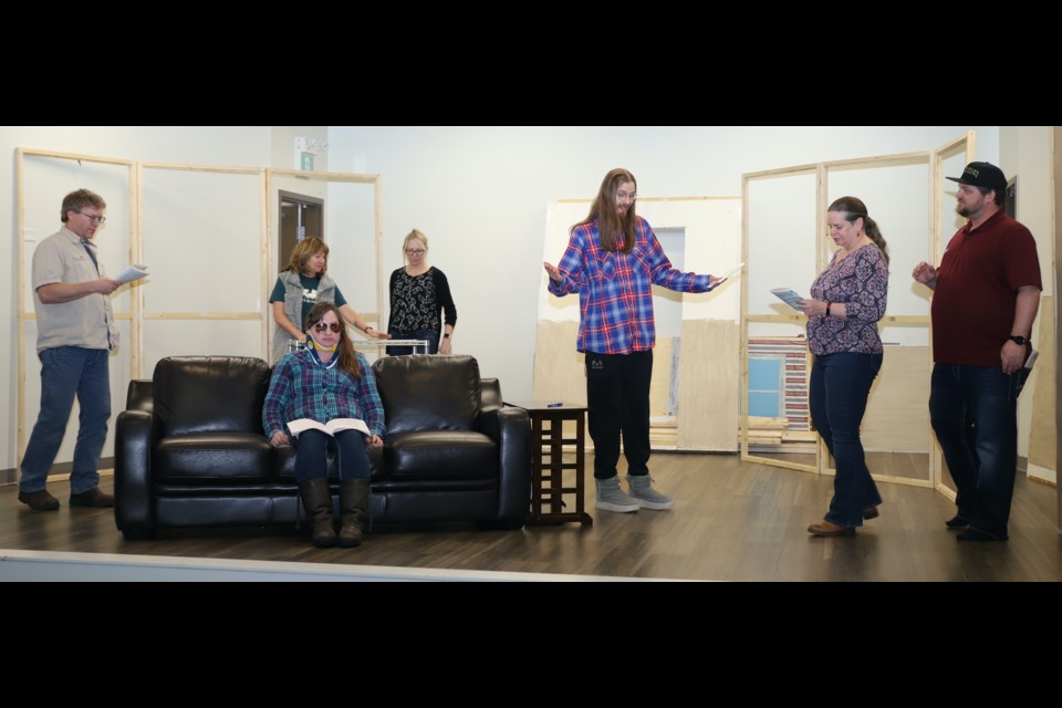 From left, Chad Hunter, Melissa Braun (on couch), Kathy Dallas, Kim Urichuk, Nic Knorr, Elaine Knorr and Chris Fieguth rehearse a scene from the play.