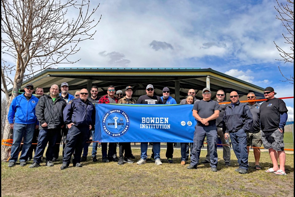 A group photo of Bowden Institution members of the Union of Canadian Correctional Officers (UCCO) that represents 302 correctional officers at the 704-inmate prison. They were at a rally at Innisfail's Centennial Park on April 29 to oppose Correctional Service Canada's recent implementation of the new Prison Needle Exchange Program. Johnnie Bachusky/MVP Staff