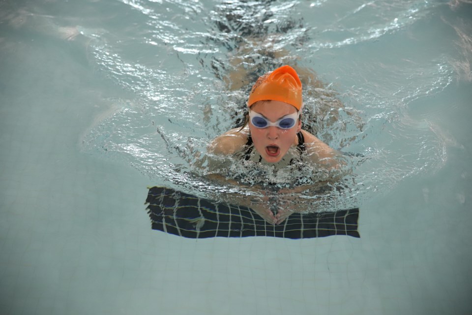 Liviah surges to the end in the swimming portion.