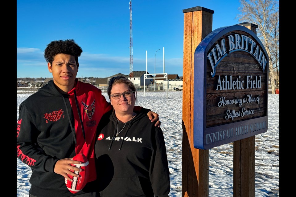 Dylan Pimlott and his mother Natasha Kuchera at Inniafail's Jim Brittain Athletic Field in late December. Dylan has been accepted to the 2024 Big Time Players 7v7 program, which was created by retired Calgary Stampeders' Keon Raymond. Johnnie Bachusky/MVP Staff