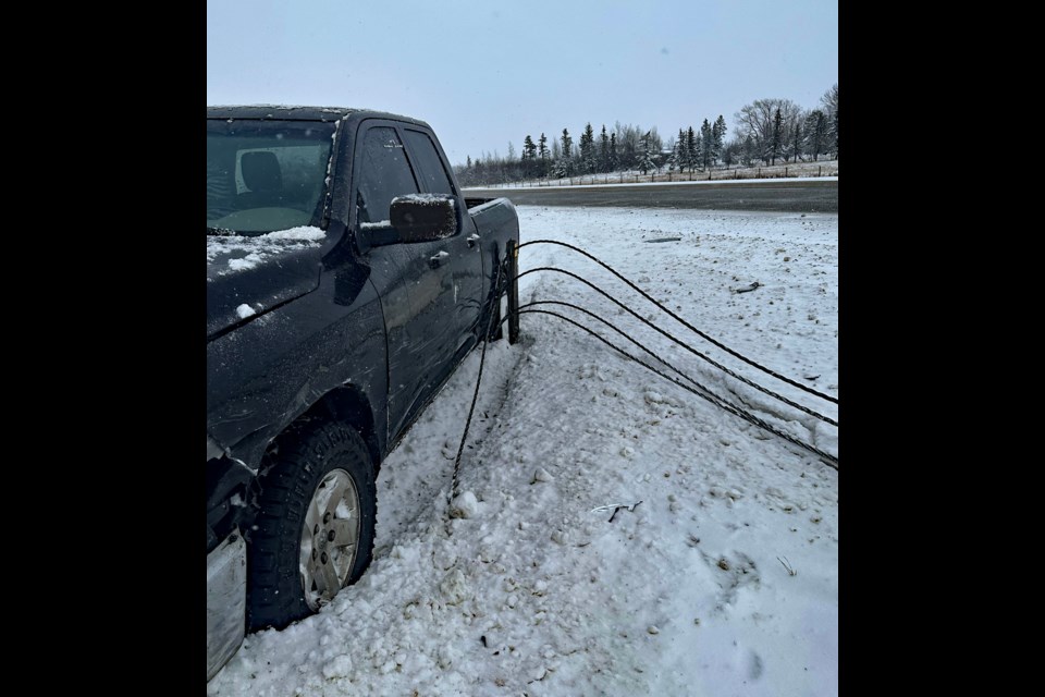 The back end of Sheryl Knock's 2012 Dodge Ram 1500 pickup truck was tangled up with median barrier wire following the crash between Knock's vehicle and a hit and run driver. 
Submitted photo