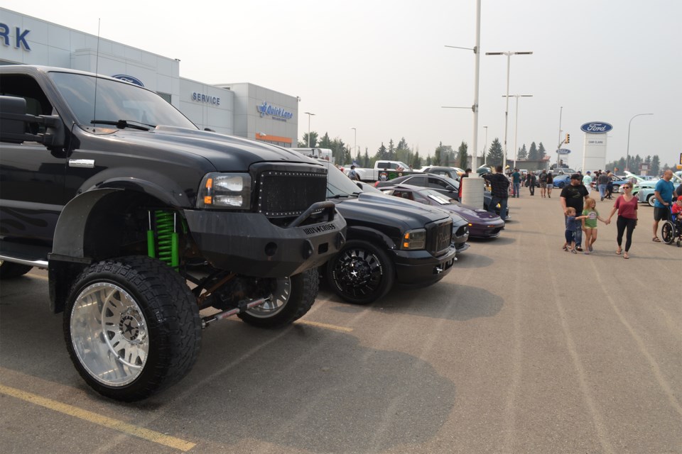 A steady stream of people checked out vehicles on display during the inaugural Cam Clark Ford car show, held Aug. 7 in Olds. 
Doug Collie/MVP Staff