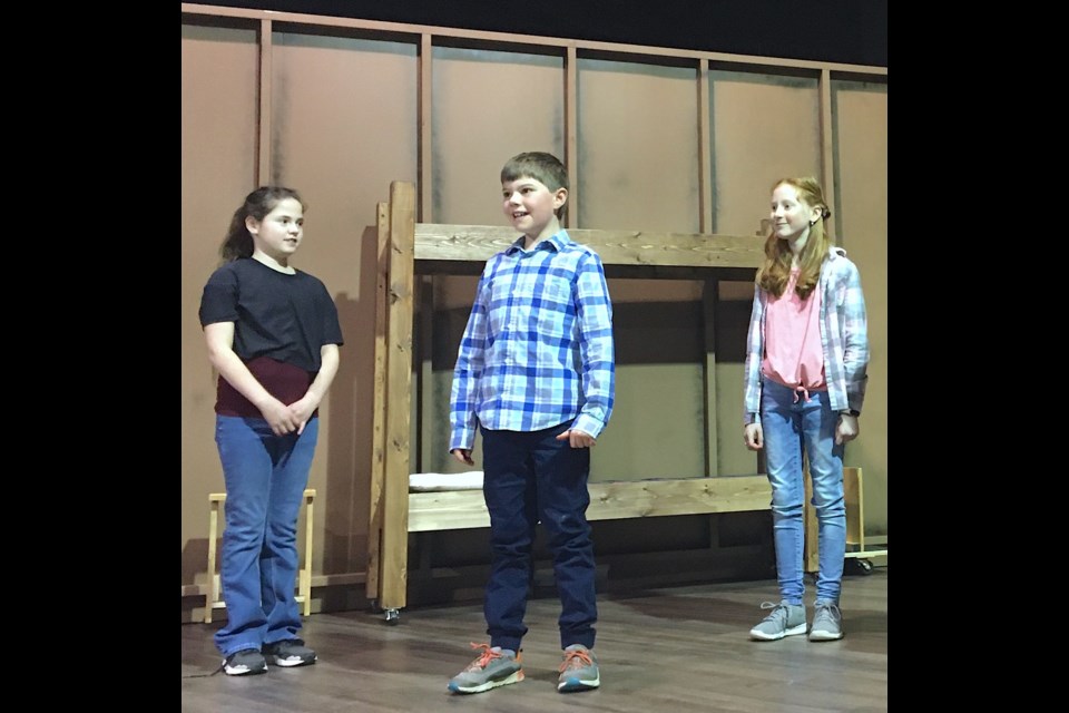 From left: Dailyn Mitchell-Chadwick, Benji Tarnoczi and Ivy Saunders were among the cast and crew rehearsing Camp Spartan – an original, locally written and produced musical – on Saturday, Jan. 21 at the Sundre Arts Development Centre. 
Simon Ducatel/MVP Staff