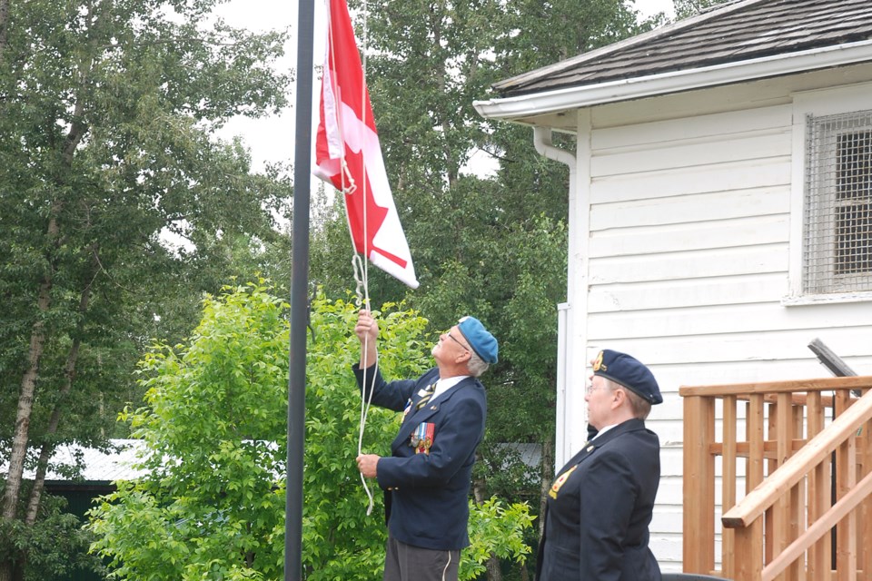 Fred Gillies, a member of the Royal Canadian Legion Sundre branch 23, raises the flag during the brief Canada Day ceremony. 
Simon Ducatel/MVP Staff