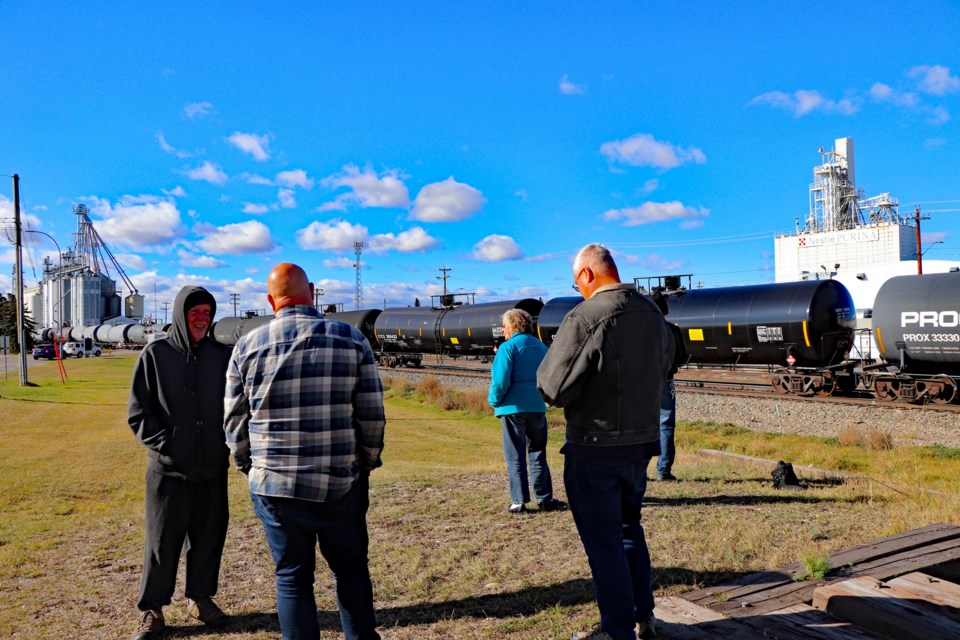 A group of train enthusiasts gather at the remnants of an old loading platform near Innisfail's Main Street waiting for the brief appearance of locomotive 2816. Johnnie Bachusky/MVP Staff