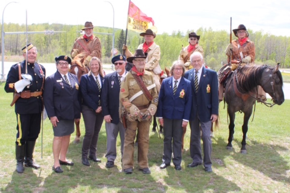 The Sam Steele’s Scouts (from left to right) on horseback are Lt.Rob Orser, Craig Farkas, Karen Orser, Heather Hamilton. The Regimental Sergeant Major is Brent Denoncourt, standing. The middle man in the Buckskin outfit is George Rogers, who kindly donated the cannon. 