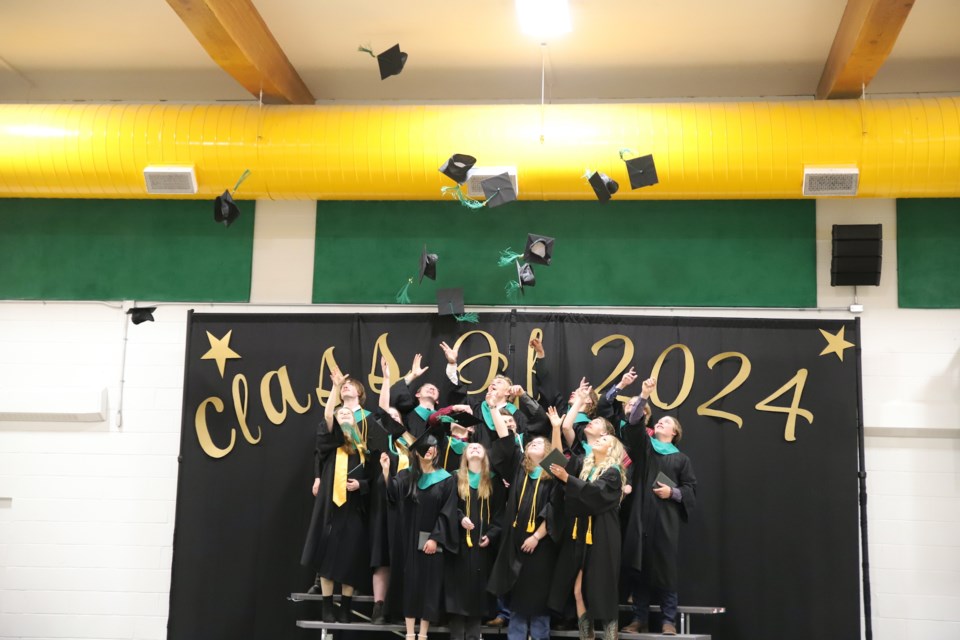 Following tradition, 2024 Bowden Grandview School grads toss their hats into the air.
Doug Collie/MVP Staff