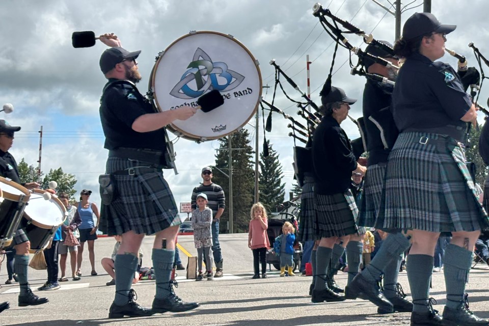The Cochrane Pipe Band was among several bands to take part in the July 19 Carstairs Beef and Barley Days parade. Parade watchers  lined both sides of 10th Avenue South and Gough Road.
