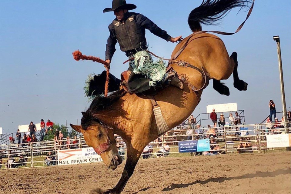 Dallas Albertson, from Crossfield, scores a 75 in bronc riding during Bulls N' Broncs in Carstairs on Saturday, July 17.
Dan Singleton/MVP Staff