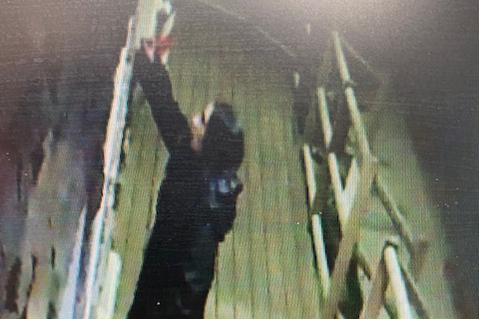 A still image from video surveillance recorded by a security camera installed at a building 4919, 53rd Street seems to have caught in the act a suspect accused of scratching the windows of numerous local businesses. 
Image courtesy of Jon Van der Velden