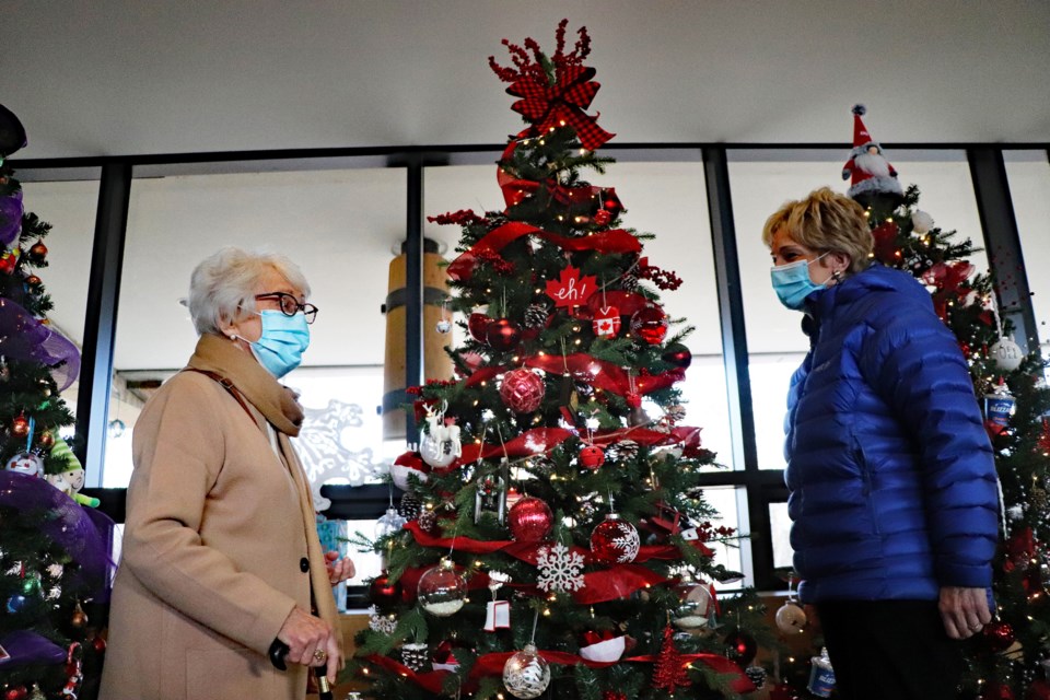 Former Innisfail mayor Pat Newman (left) and current mayor Jean Barclay tour the Innisfail Festival of Trees that opened up for the public on Nov. 19. Johnnie Bachusky/MVP Staff