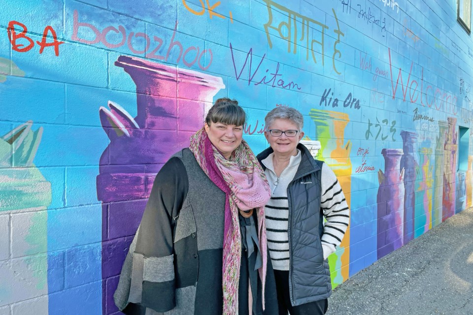 Innisfailian artist Karen Scarlett (left) and local community builder Janice Wing outside The Coffee Cottage last week. Both believe the Community Crochet BOMB Project will be a demonstration of community love, especially for seniors. Johnnie Bachusky/MVP Staff