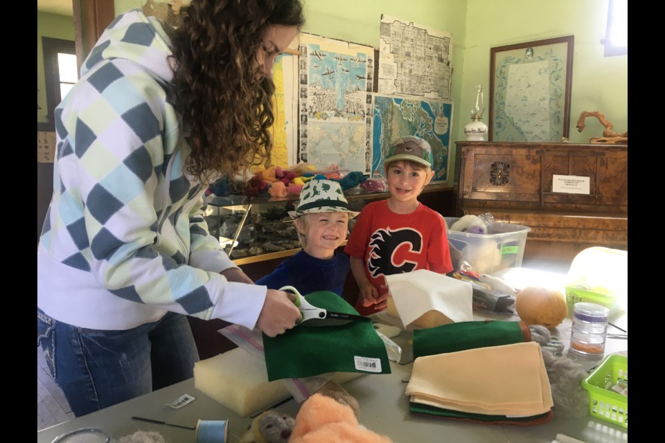 Alexis Couch helped Jane Atkins in the museum's historic schoolhouse building to demonstrate the art of felting to participants of all ages. 
Photo courtesy of Carrie Couch
