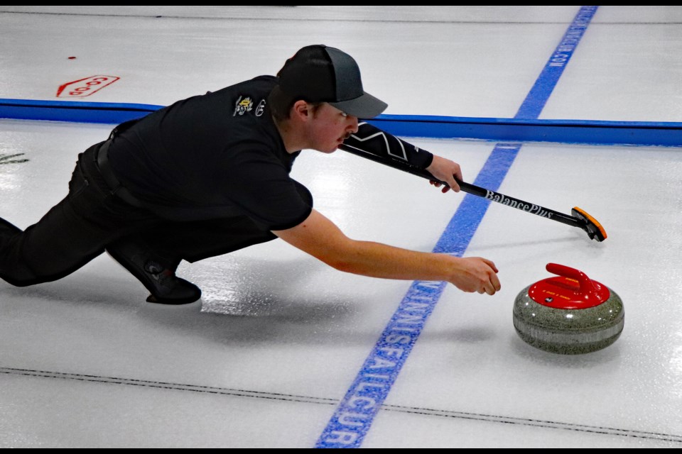 Rees Thomas delivers a throw during a semi-final game on Jan. 25 at last week's 76th Annual Innisfail Farmers/Farmerettes Bonspiel. Johnnie Bachusky/MVP Staff