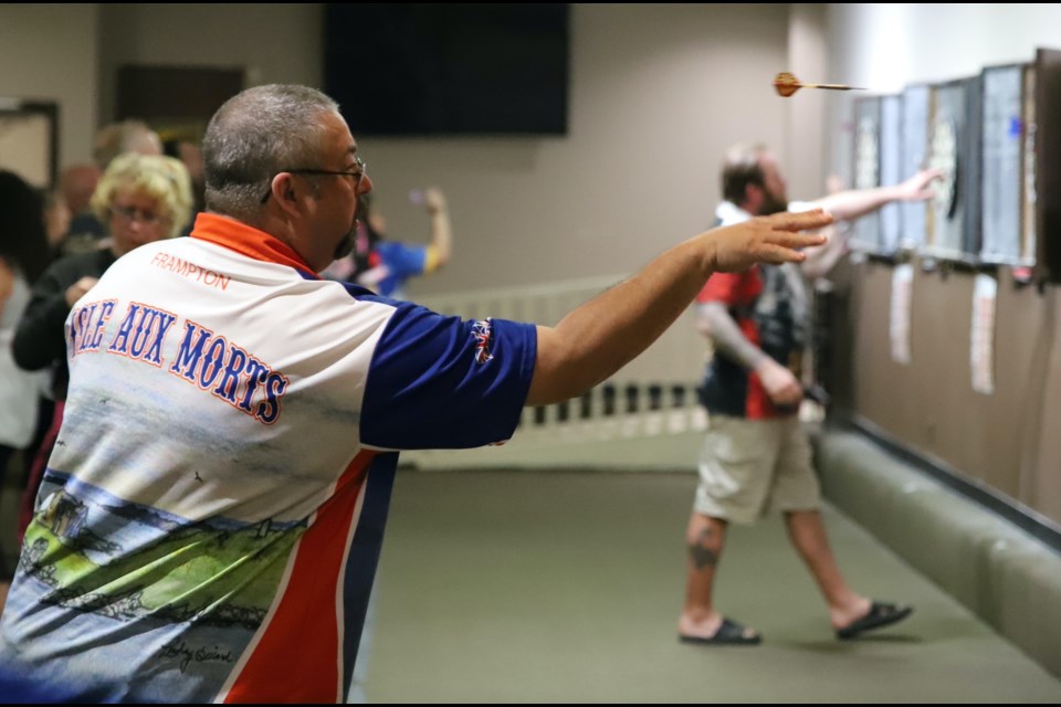 Participants compete in the second annual dart tournament in the Royal Canadian Legion Branch 105. The event, held May 4, was held to raise money for Olds & District Special Olympics. Photo by Doug Collie/MVP Staff