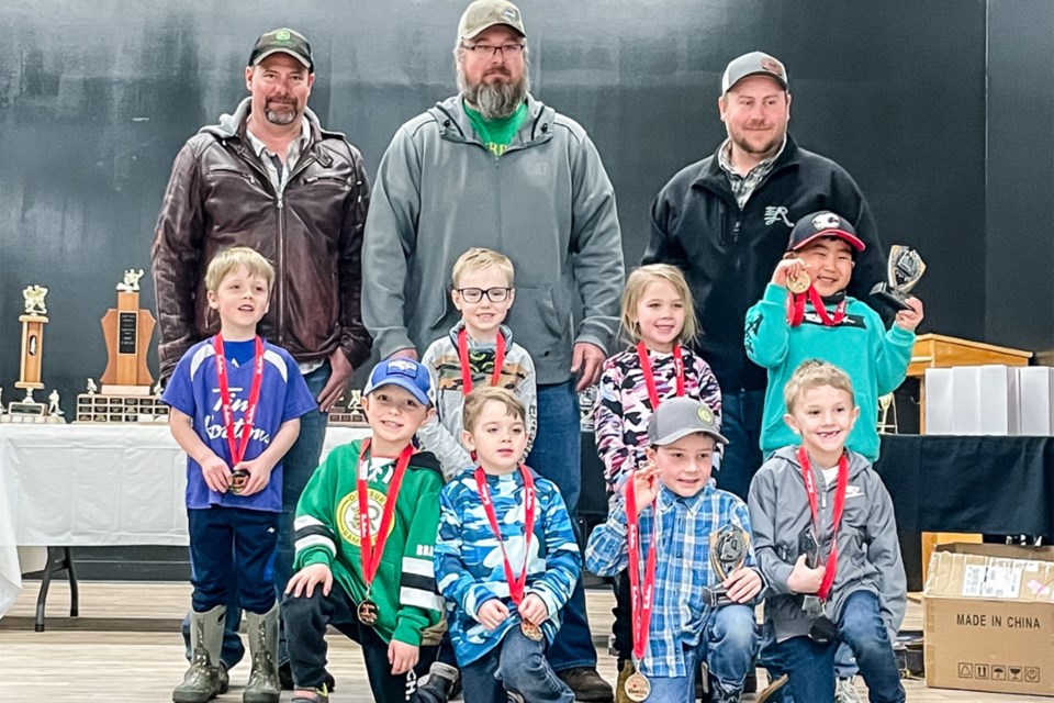 These U-7 Black team players are all smiles after receiving their awards. Head coach Shawn Murphy is in the middle of the back row.
Submitted photo