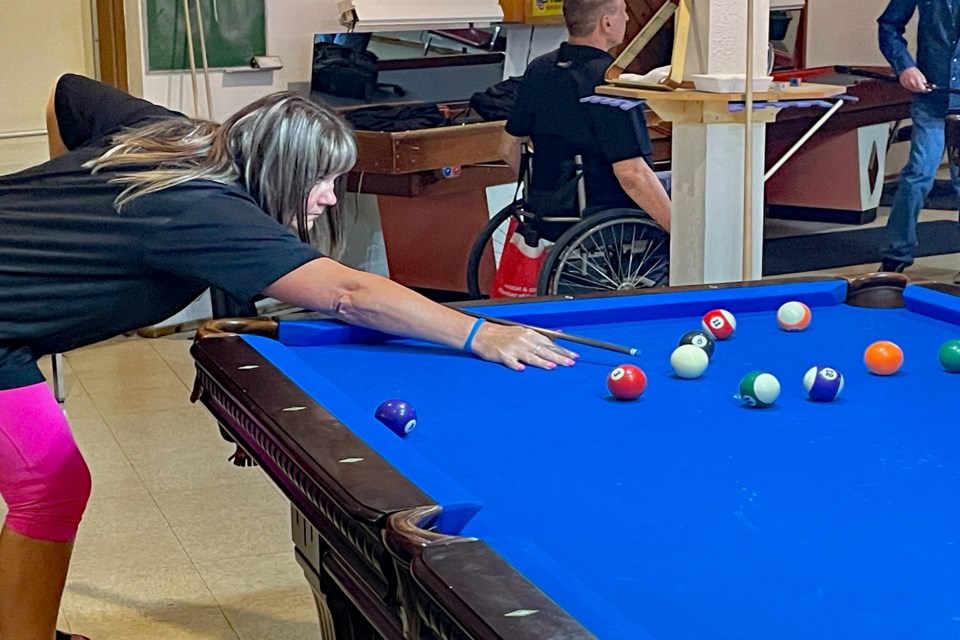 B.C.'s Leah Carroll lines up a shot during competition at the Dominion 8-Ball Pool Championships held May 26 to 28 at the Innisfail Royal Canadian Legion Branch #104. Johnnie Bachusky/MVP Staff