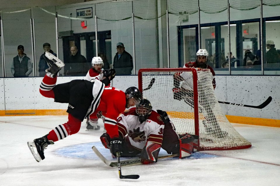 The Eagles' Justin Faryna is launched in front of the Coyotes' net during intense second period action. 
Johnnie Bachusky/MVP Staff

