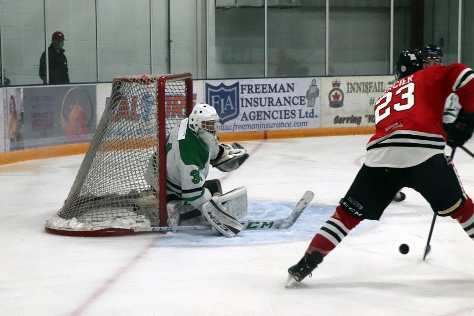 The Eagles' Pierre-Luc Mercier on the attack against Siksika netminder Arlan Kaquitts. Mercier scored two goals during Innisfail's 9 - 4 victory at home on Dec. 18. Johnnie Bachusky/MVP Staff