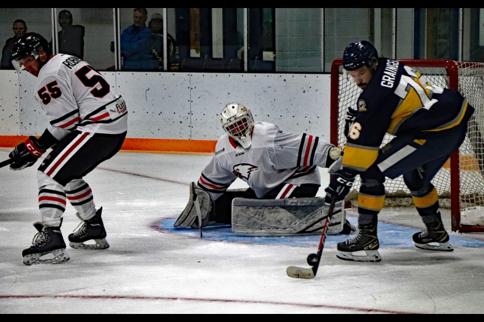 Stony Plain on the attack in front of Innisfail Eagles netminder Chance Griffith during first period action at the Innisfail Twin Arena on Oct. 21. Stony Plain defeated Innisfail 7-6 in overtime. Johnnie Bachusky/MVP Staff