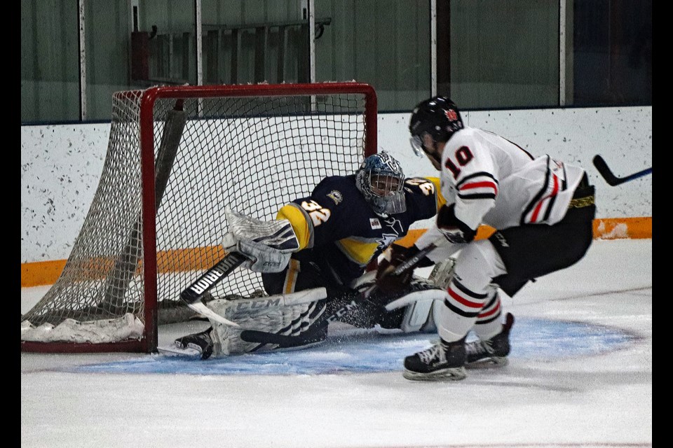 Eagles forward Chase Thudium goes in on Stony Plain goalie Wyatt Hoflin in the third period of the first game of the senior mens AAA provincial championship at the Innisfail Twin Arena on March 2. Thudium scored to make it 7-3 for Innisfail, the final goal of the game to give the home town team a 1-0 best of five series lead. Johnnie Bachusky/MVP Staff