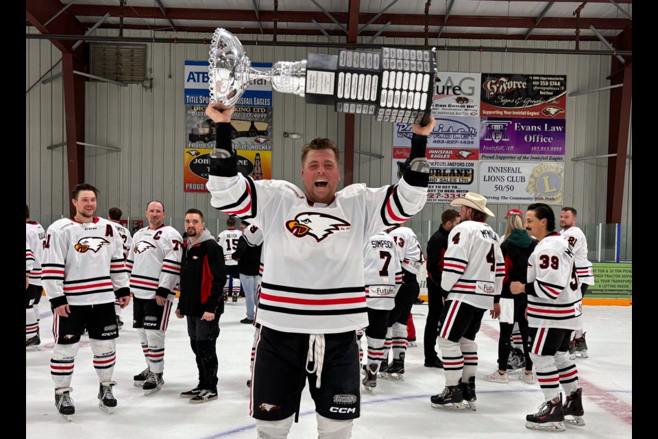 An elated Colten Hayes of the Innisfail Eagles raises the Hockey Alberta Senior AAA Provincial Champions trophy following the third game of the provincial finals at the Innisfail Twin Arena on March 22. Innisfail defeated Stony Plain 5-2 to take the best-of-five finals three games to nil. 
Johnnie Bachusky/MVP Staff