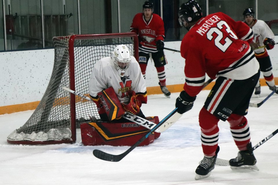 Pierre-Luc Mercier, a new centre for the Innisfail Eagles, is stopped by Fort Macleod goalie Daniel Wenham during second period action on Dec. 4. Mercier scored two goals in the game. Johnnie Bachusky/MVP Staff