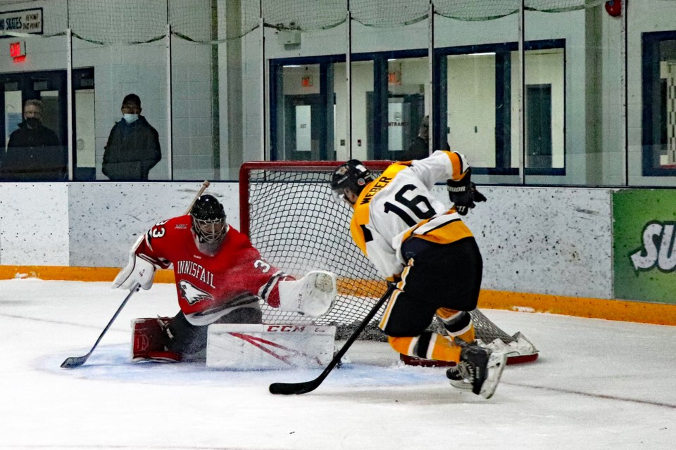 The Eagles' Jason Reckseidler makes a key stop during the shootout against the Nanton Palominos on Jan. 15. The Eagles scored after to claim a 6 - 5 victory. Johnnie Bachusky/MVP Staff