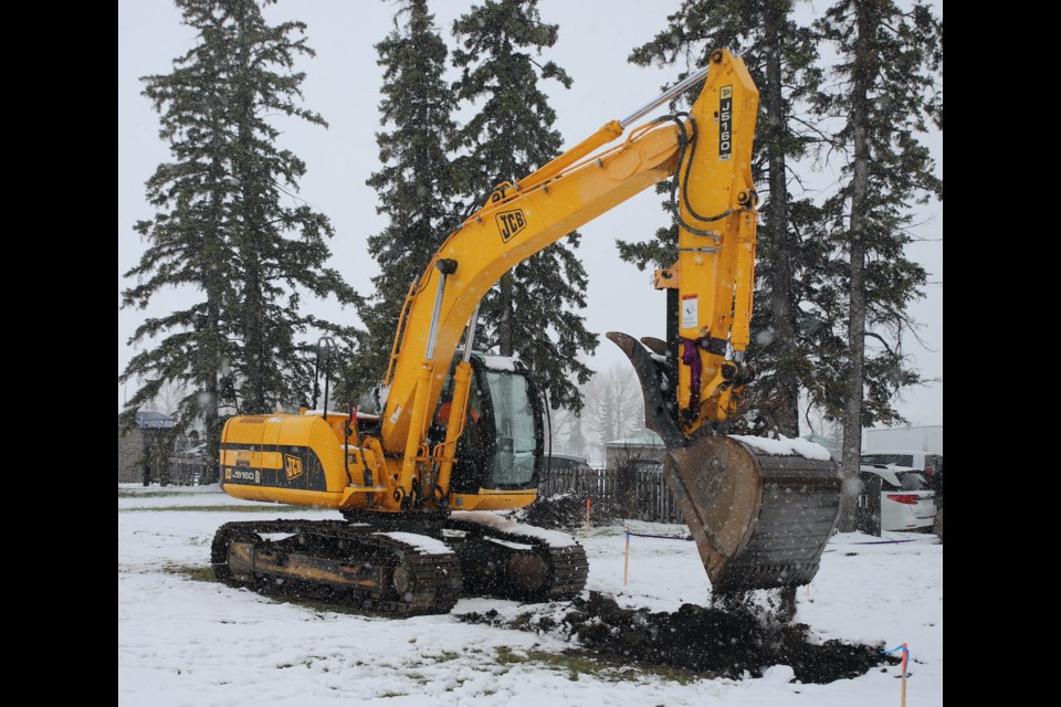 Shane Webb of Webb’s Excavating digs the first dirt for Kirsten’s Place, the emergency shelter, with a backhoe. Photo by Doug Collie/MVP Staff