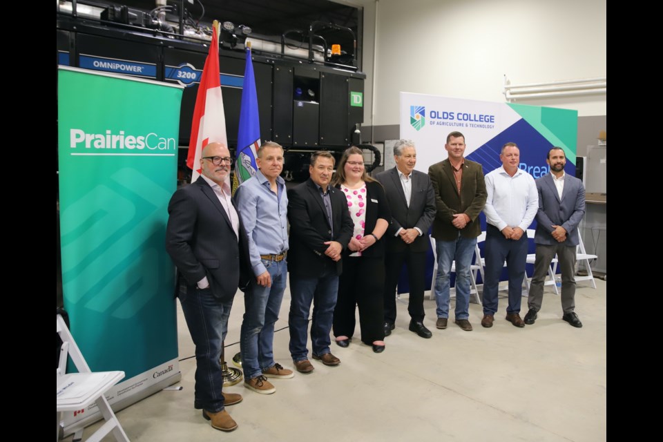 Speakers who took to the podium during an announcement regarding money for ag-related initiatives pose for a photo after the announcement, made July 3 at the Olds College of Agriculture & Technology’s Smart Farm Operations Centre.
Doug Collie/MVP Staff