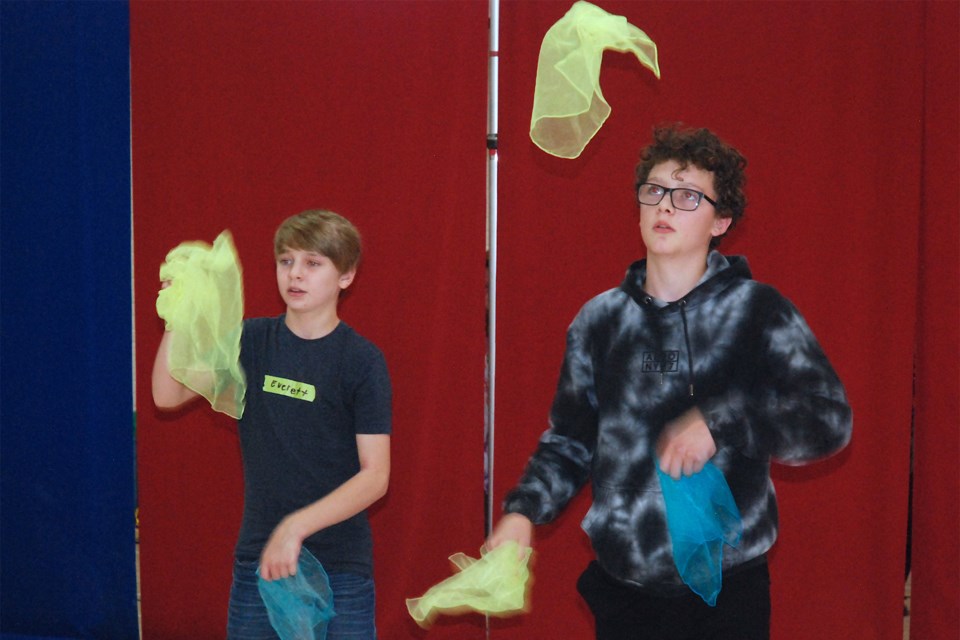 Everett, left, and Owen Crossey try their hand at juggling. 
Simon Ducatel/MVP Staff