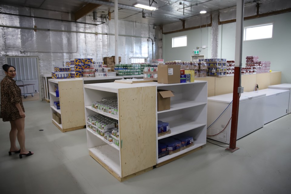 Mountain View Food Bank president Tayva Graham stands in a spacious area of the organization's new location.
Doug Collie/MVP Staff