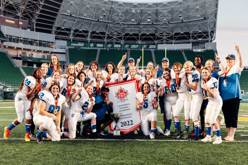 The golden Team Alberta women's football squad following their championship-winning performance in the final game on July 9 at the first-ever 2022 Women's Under-18 Championship in Regina. Innisfail's Lillian Watkinson, a key Alberta player on defence, is number 17 at the far right of the photograph. Submitted photo