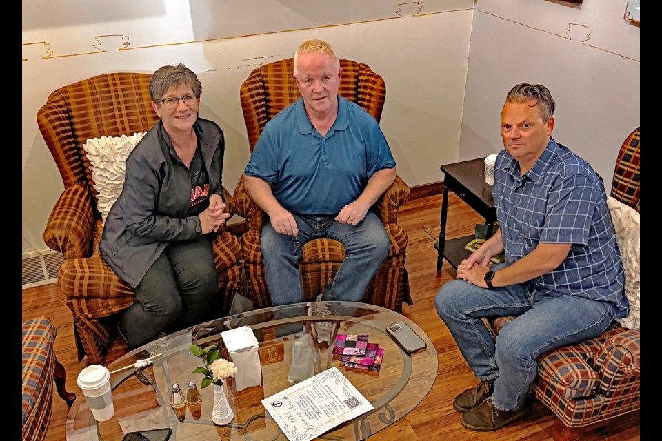 Innisfailians Bev Carson, Jim Carroll, centre, and Jason Heistad have signed up as volunteers for the Forever Canadian petition initiative. Johnnie Bachusky/MVP Staff