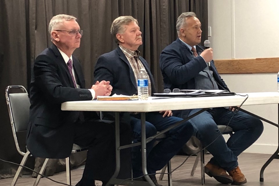 Larry Gratton, left, emcee Dan Harder, centre, and Grant Abraham take part in the April 17 Olds forum.