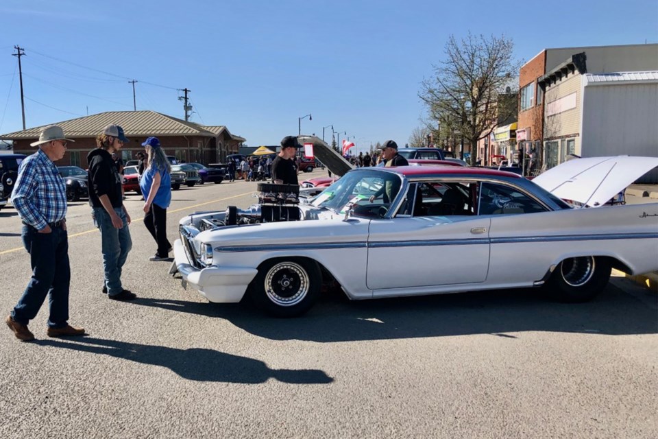 Guests look over a mint condition 1960 Desoto Adventurer 500/871 owned by Gord Robinson during Saturday's Fuel-A-Palooza.
Dan Singleton/MVP Staff
