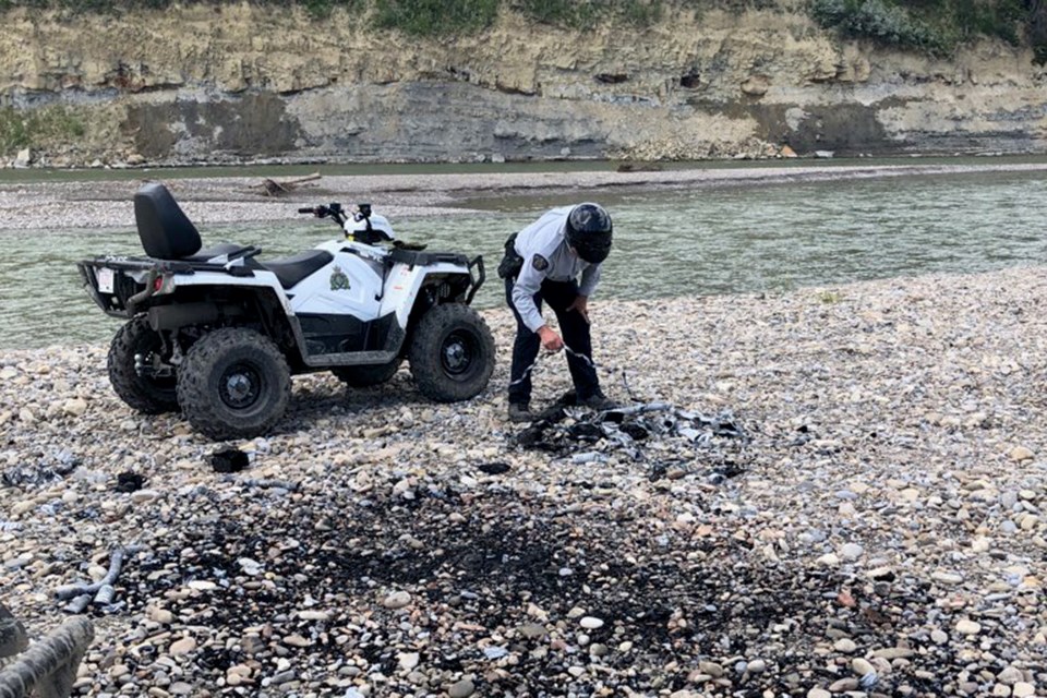 RCMP members returned to the Garrington Bridge area on July 26 to survey the damage from parties the night before. They found garbage and empty alcohol containers among other things. 
Photo courtesy of Innisfail RCMP