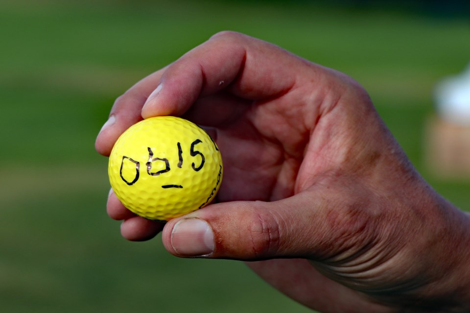 One of the 1,575 golf balls that fell from a 100-foot crane on Aug. 19th at the Innisfail Golf Club. The event was the Second Annual Innisfail Kinsmen Golf Ball Drop Raffle. Johnnie Bachusky/MVP Staff