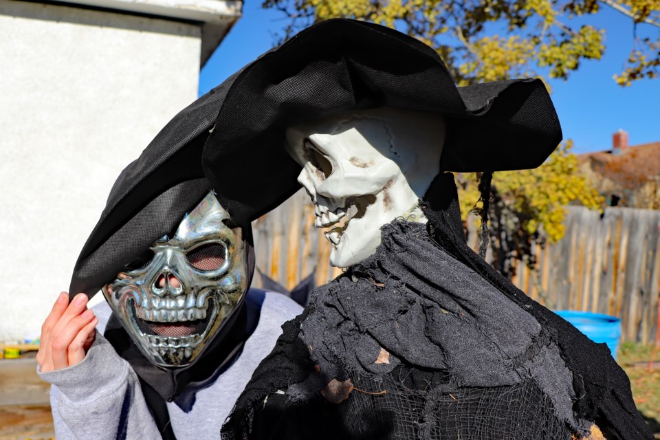 Bowdenite Shelby Mackie (left) hams it up with the witch at the family's Haunted House along Main Street, which has delighted hundreds and hundreds of local trick-or-treaters on Halloween for the past 17 years. Johnnie Bachusky/MVP Staff