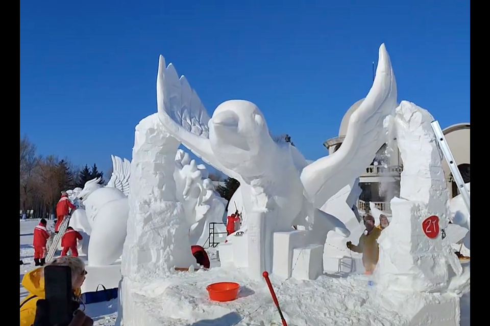 A still taken from video that captured the moment when the team of Alberta sculptors’ piece on peace collapsed. 
Morton Burke Facebook